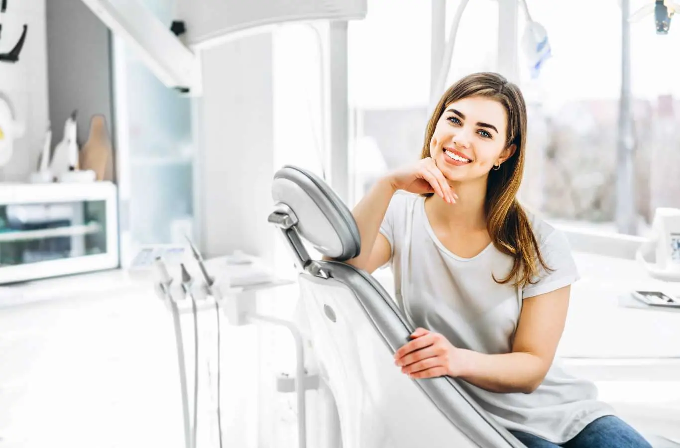 Smiling woman sitting in a dental chair in a bright modern dental office at Loveland Dental Group of Fort Mill, SC